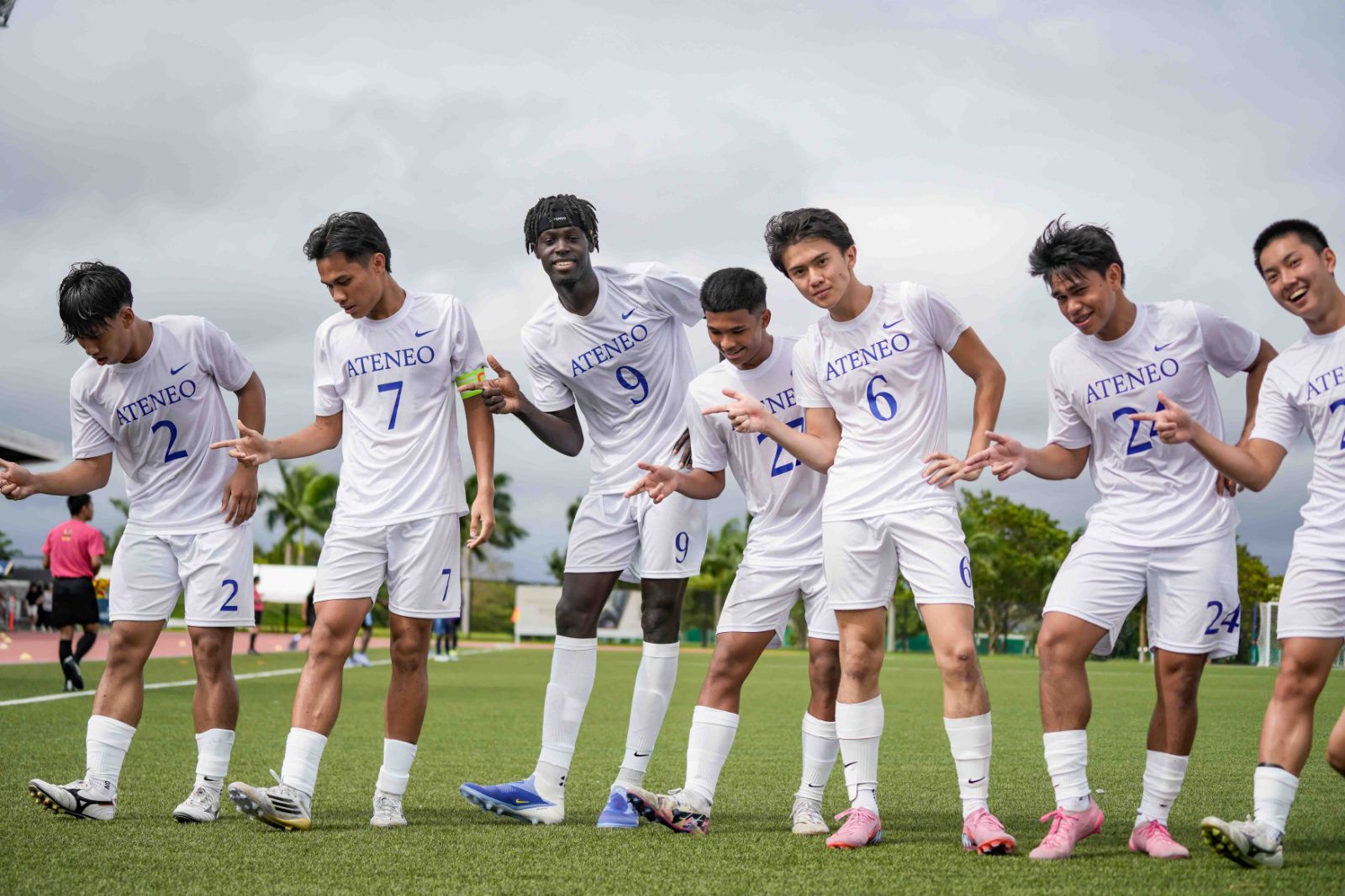 Mateo Lacson poses with the Ateneo Men's Football Team