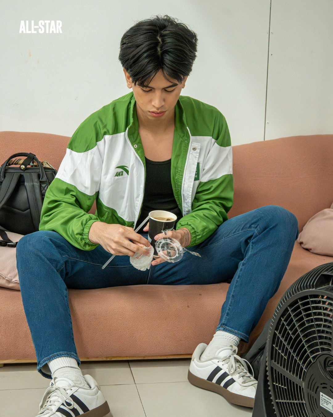 College of St. Benilde Point Guard Nathan Victoria with his Damn Strong Coffee. Photo by Zai Ventura