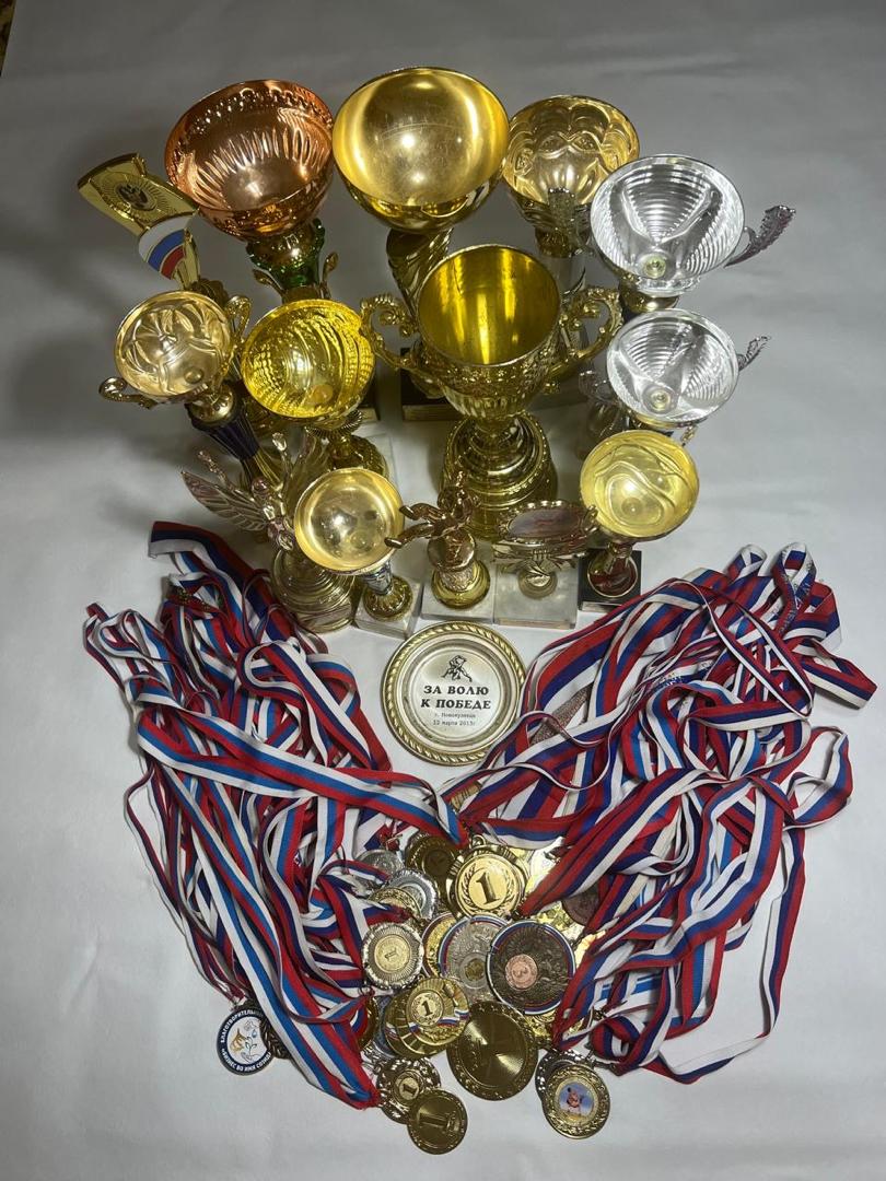 Sunset Lover's medal's and trophies from wrestling
