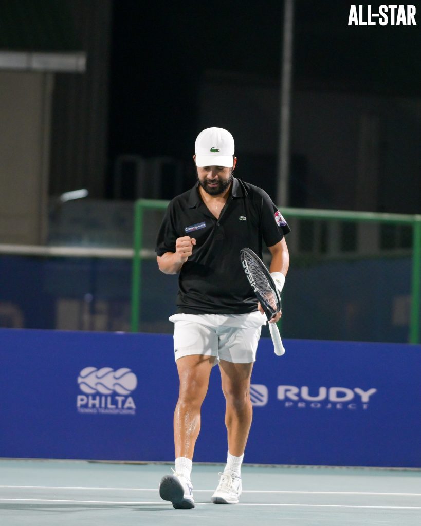 Francis Alcantara celebrates after a point,