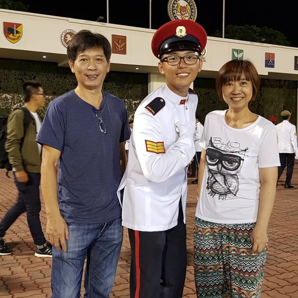 Ong Wei Sheng with his parents during his graduation as a Specialist in the Singapore Armed Forces. 