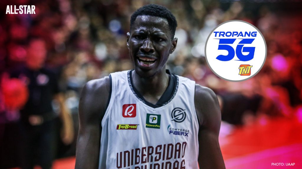 Malick Diouf wearing a UP jersey with TNT logo on the side.