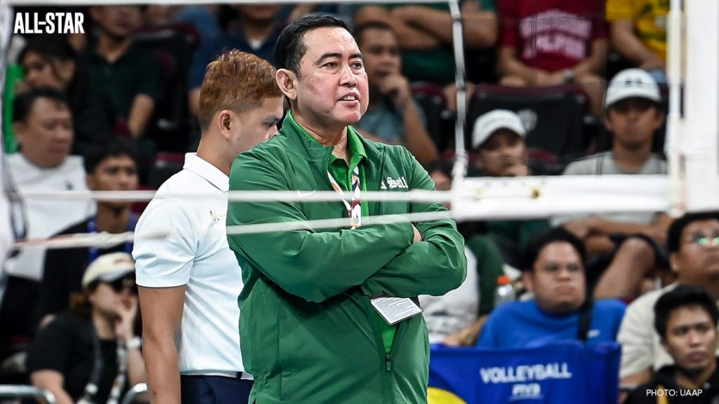DLSU Lady Spikers Coach Ramil De Jesus looks on while his team plays.