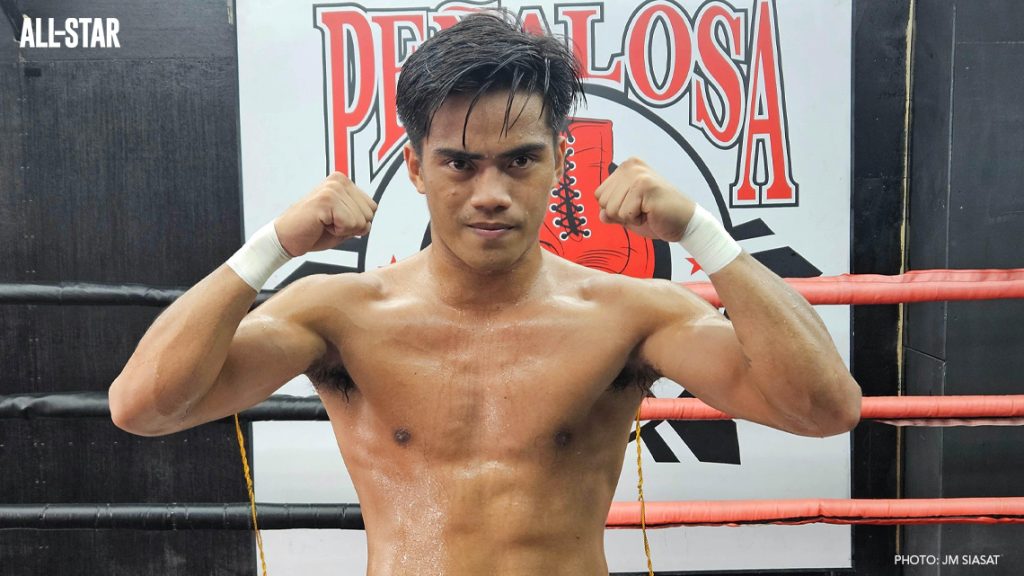 Kenneth Llover flexing his muscle.